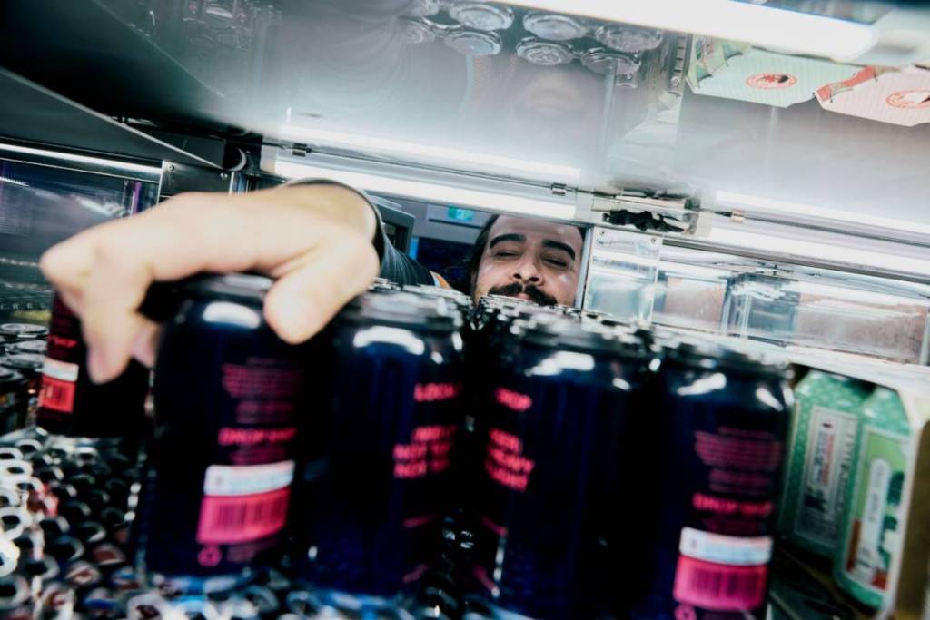 person picking drinks at drop shop melbourne