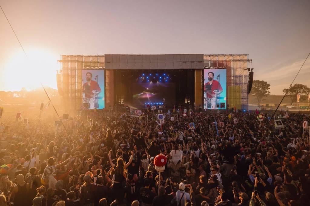 musician performing on stage during day time at Beyond The Valley