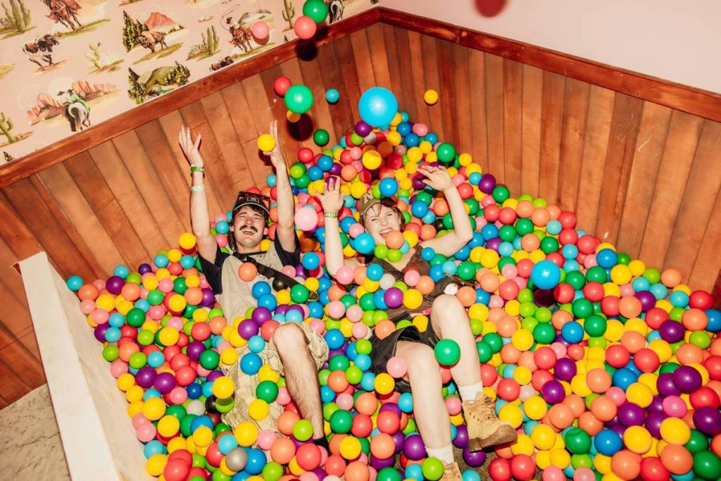 two people in ball pit at Jack Daniel's House Party in Beyond the Valley
