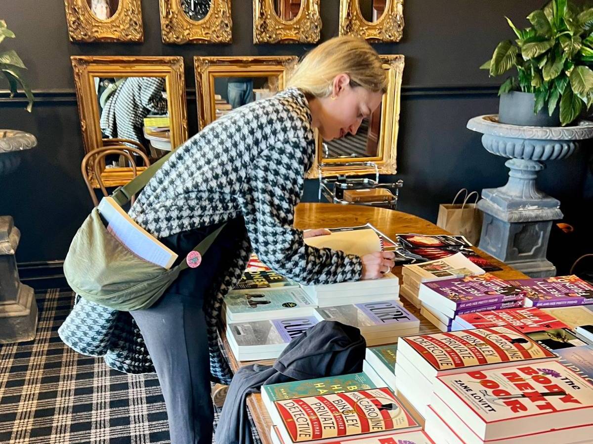 woman looking at books at Words in Winter festival
