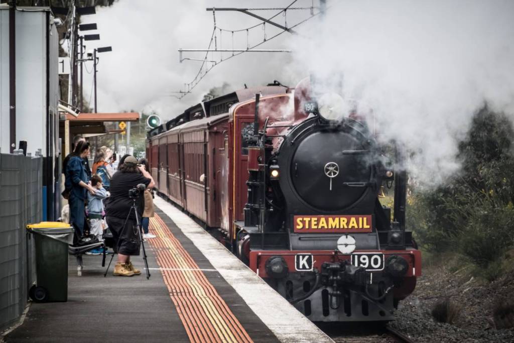 Steam train from Steamrail Victoria at a platform to take passengers to Hurstbridge Wattle Festival