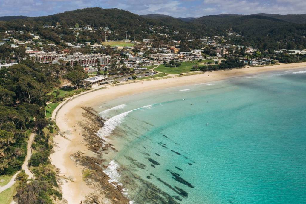 Aerial view of Lorne Beach and the coastal town beside clear turquoise waters