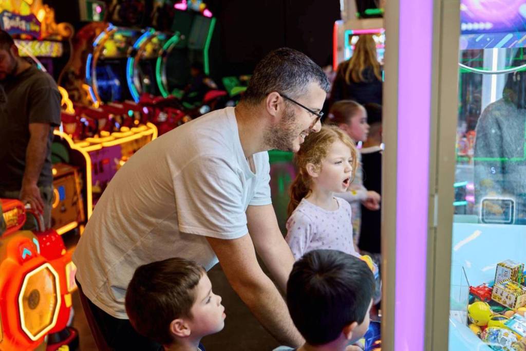 family playing in arcade at Hoopla Pakenham in Melbourne