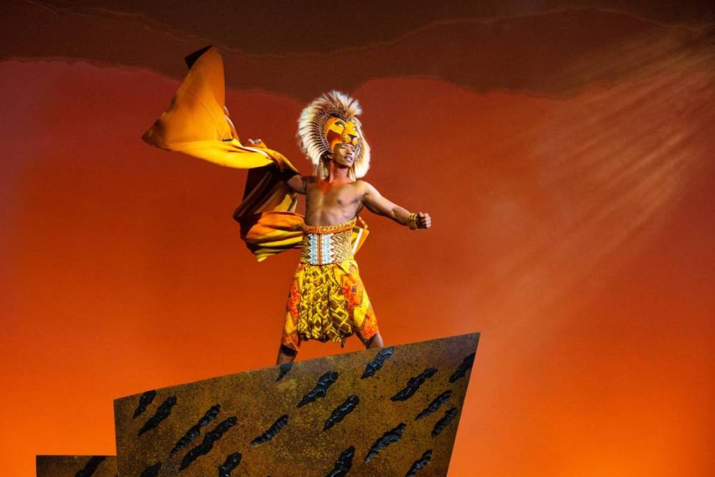 Simba on Pride Rock in The Lion King musical
