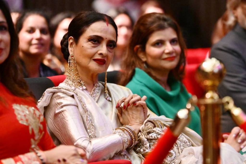 Actress Rekha seated at a film festival