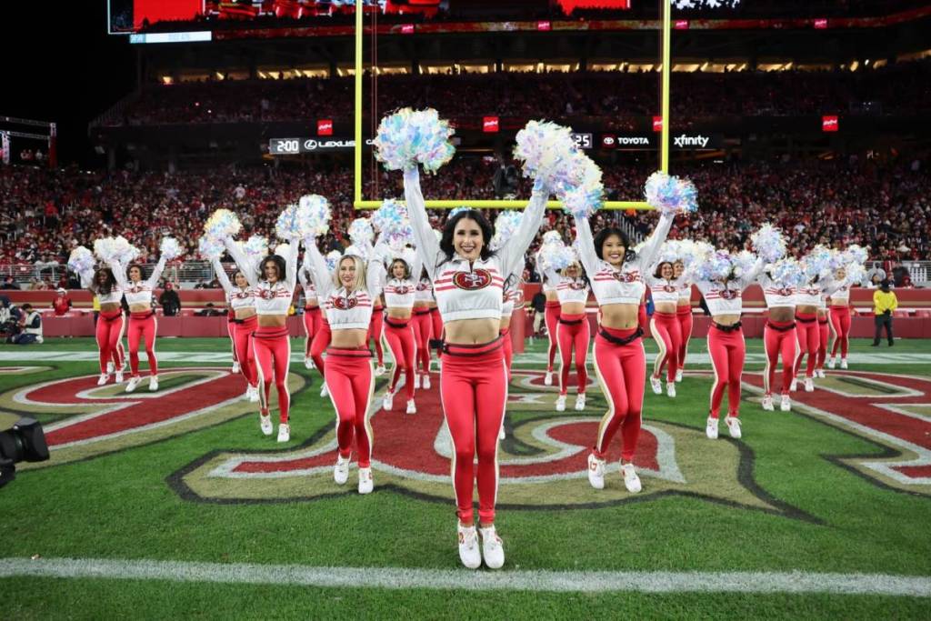 49ers gold rush cheerleaders at an NFL game