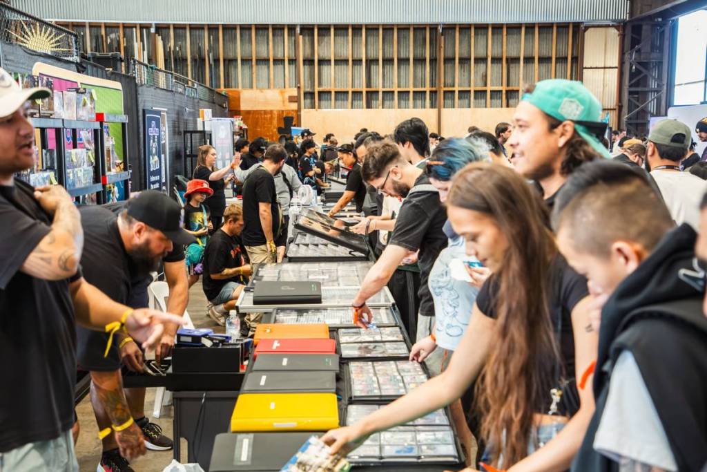 people looking at trading cards at Cardcore market