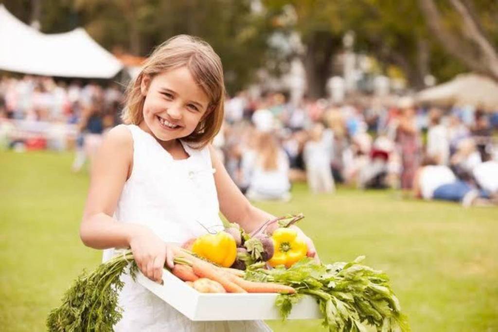 little girl with fresh produce at Melbourne's Bayside Farmers Market
