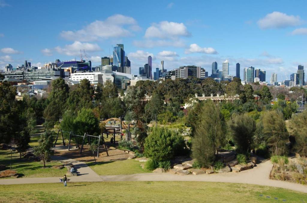 a view of the playground at Royal Park, with city skyline in background