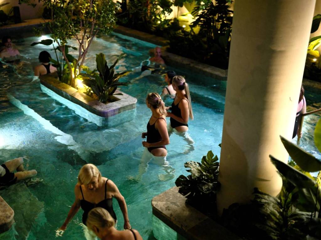 people hanging out in the pool at Soak Bathhouse