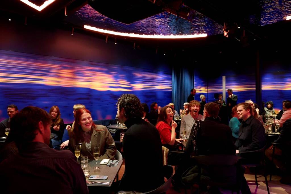 people chatting at tables at The Beacon in Melbourne Recital Centre