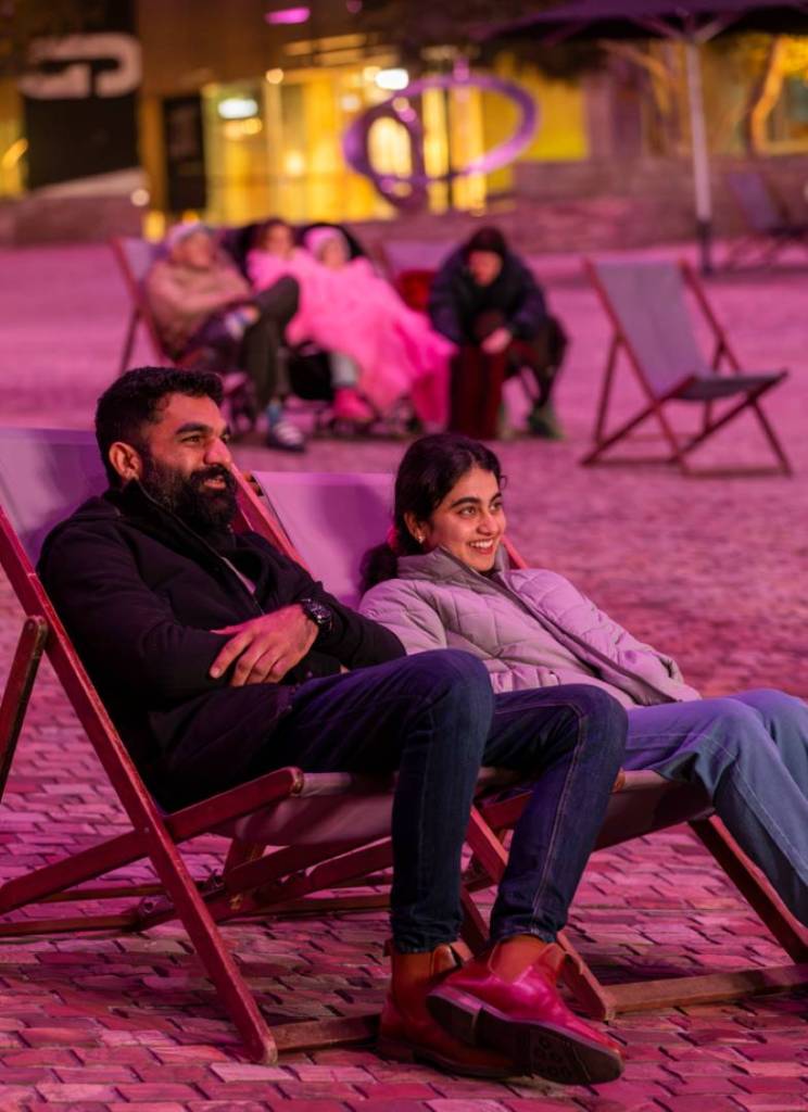 people seated near fed square's big screen