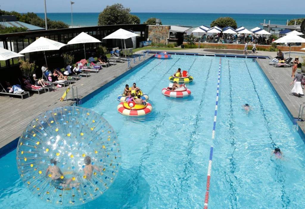 families having fun in the outdoor pool at Lorne Sea Baths
