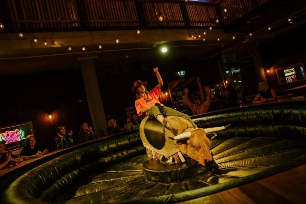 person riding the mechanical bull from texas as moon dog