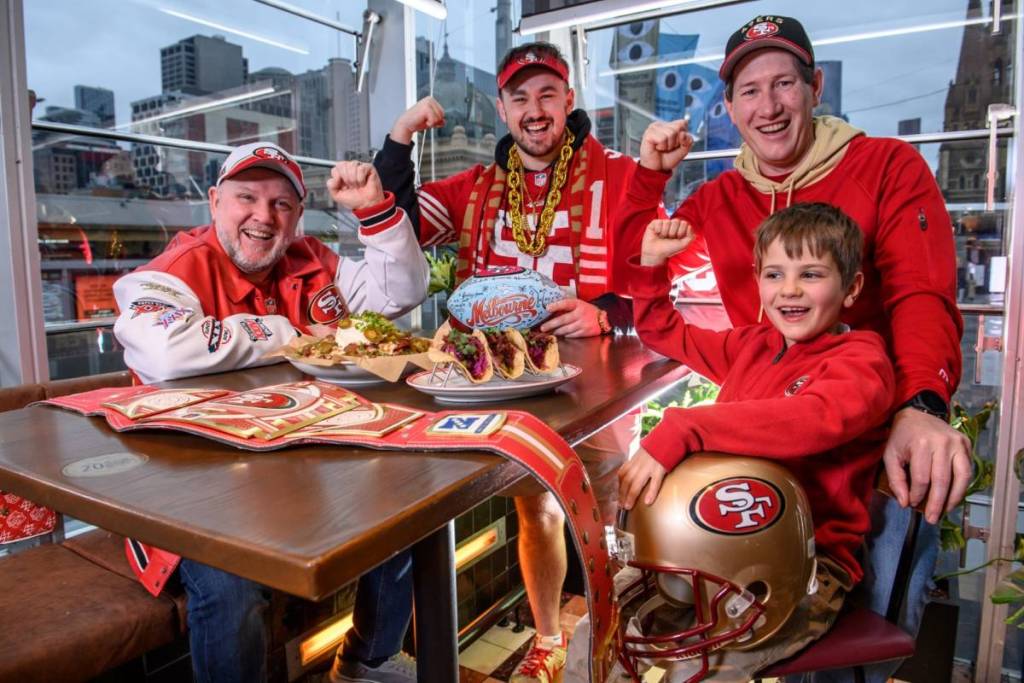 San Francisco 49ers fans at Transport Public Bar, with NFL-themed food like loaded fries