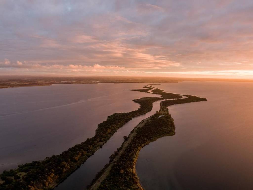 aerial view of the Mitchell River Silt Jetties at sunset