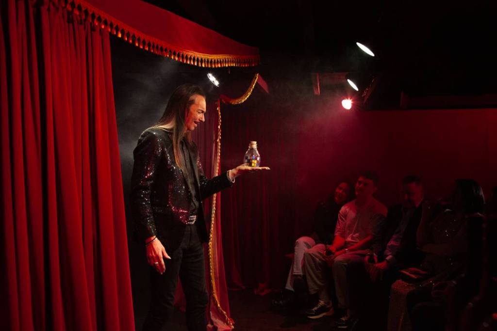 a magician on stage at Piccolo Teatro
