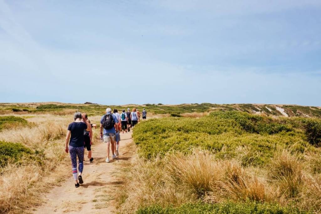 people walking the cape woolamai circuit walk in Philip island in Melbourne, victoria