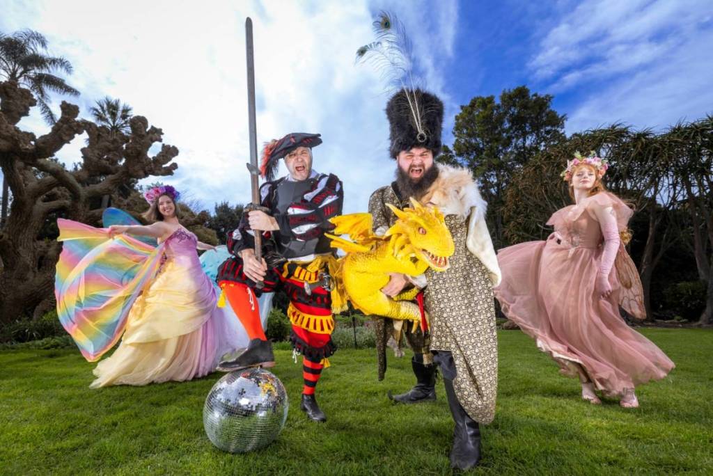 people dressed in costume as knights and maidens with a dragon for Renfair Rave