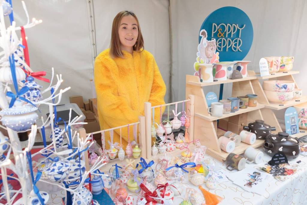 vendor at market stall with her products at Chinese Traditional Cultural Festival
