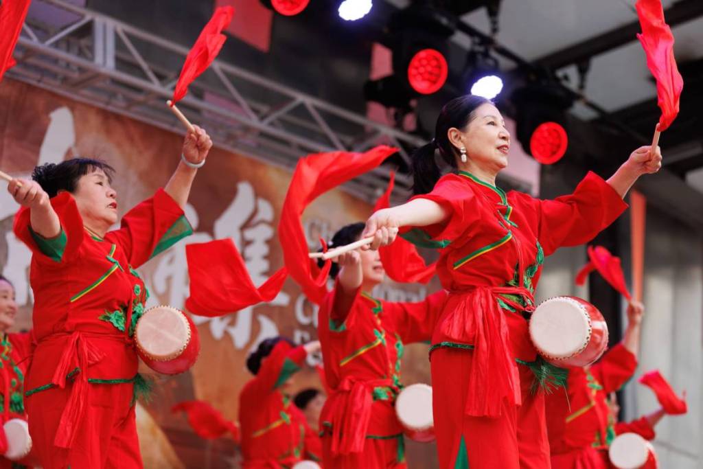 performers on stage with drums and ribbons at Chinese Traditional Cultural Festival
