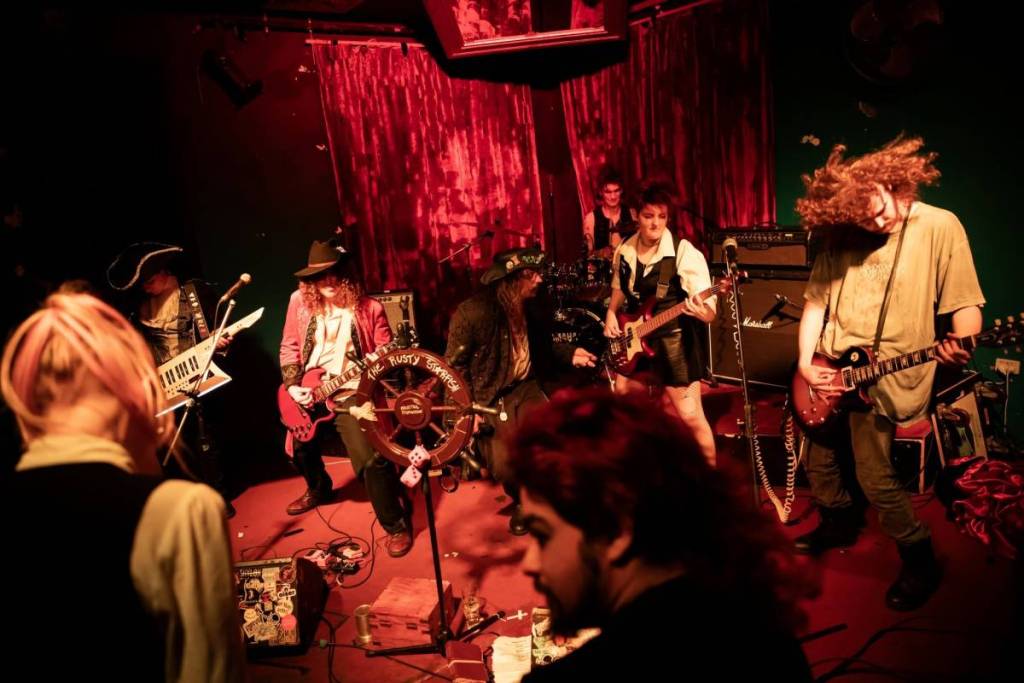 Projectile Dysfunction performing live on stage dressed as pirates
