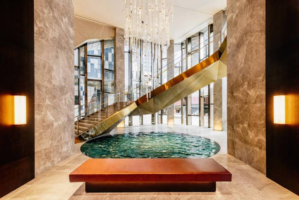 Ritz-Carlton lobby area with a little pool and a grand staircase