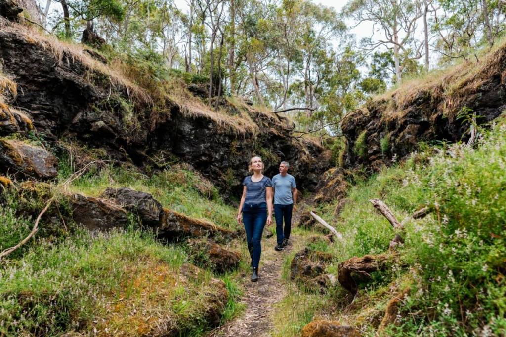 two people walking on trail in Tower Hill Wildlife Reserve