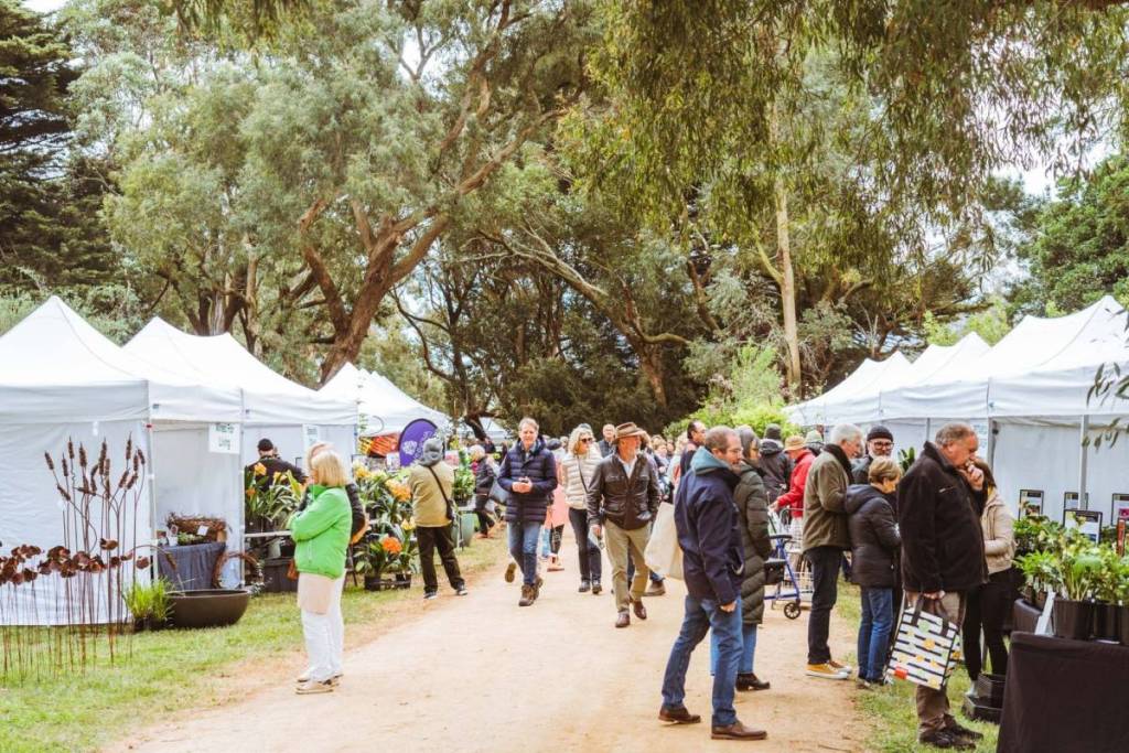 people walking through stalls at Bolobek Garden Fair