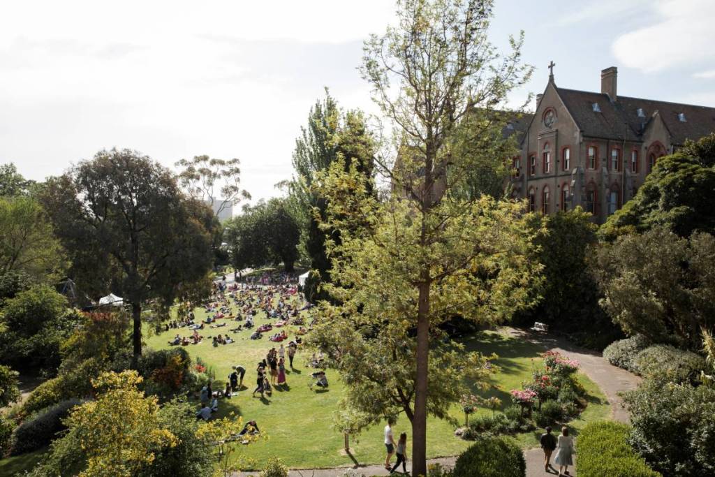 the lawn at Abbotsford Convent on a sunny day, with people relaxing