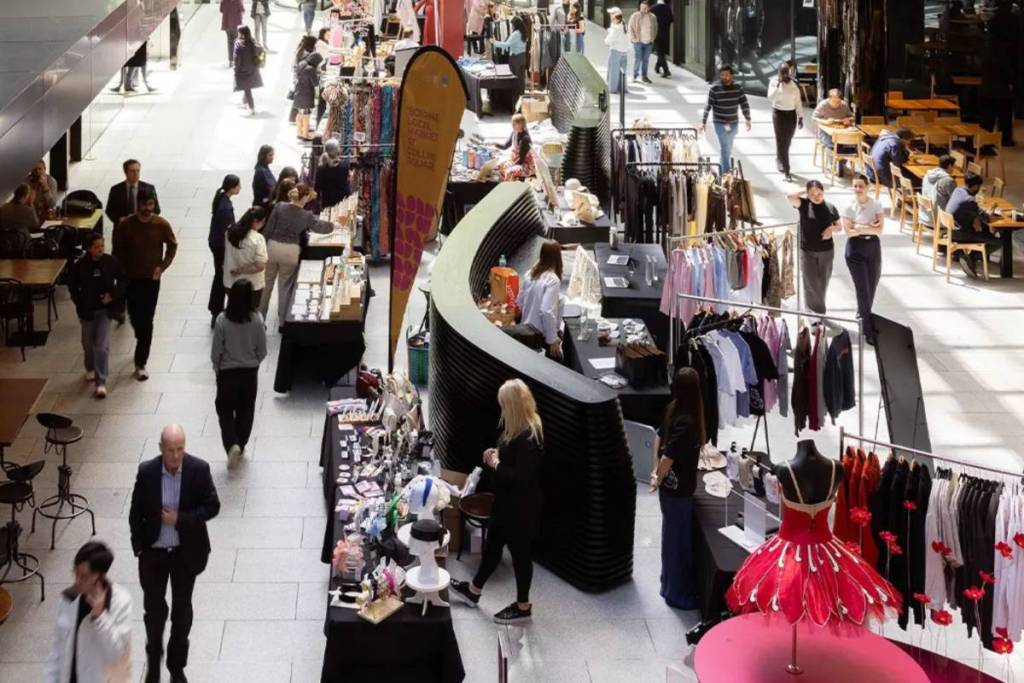 people shopping at fashion market in Collins Square
