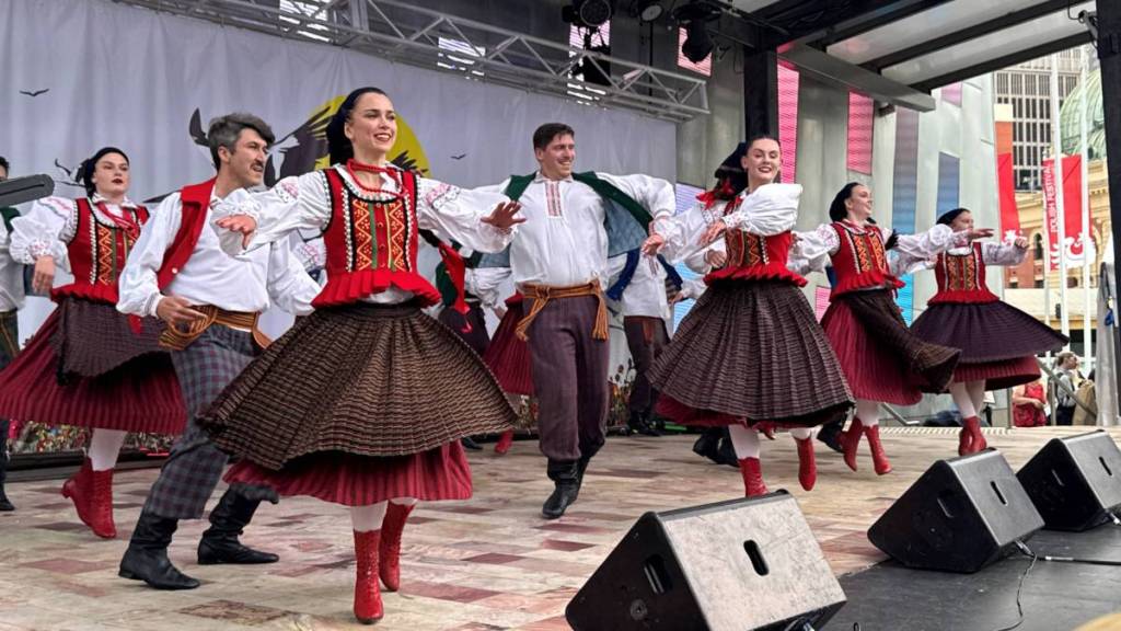 folk dance group performing on stage at Polish Festival