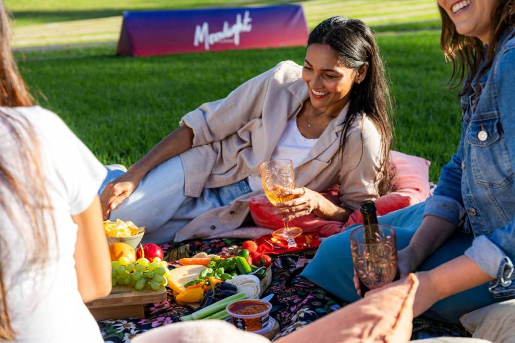 people enjoying a picnic at Moonlight Cinema