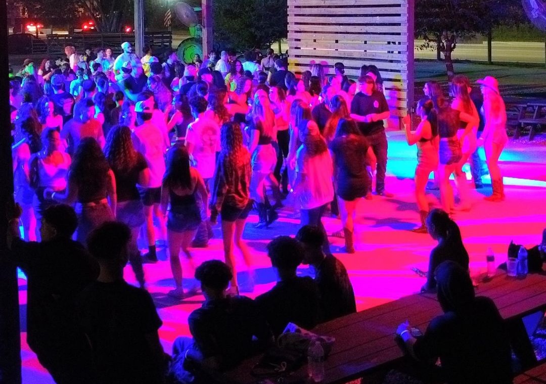 The Berry Farm line dancing at night
