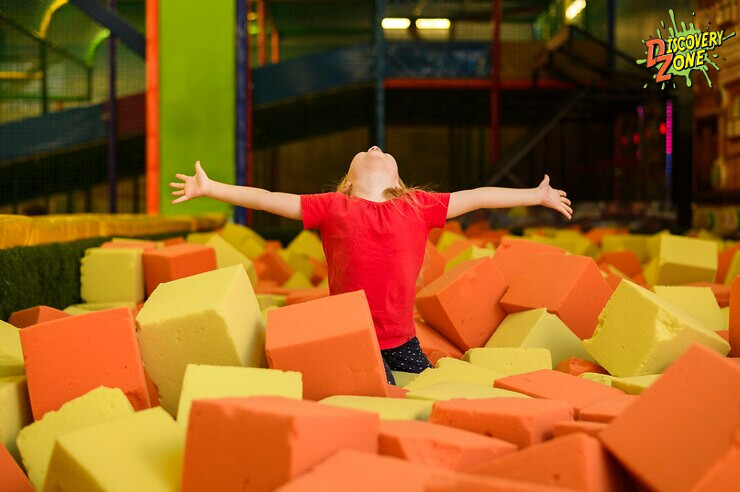 child plays in foam play area