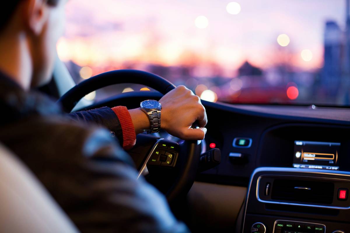 Hand on a steering wheel