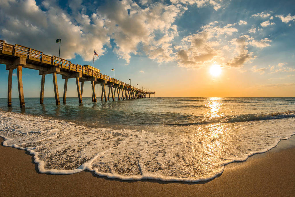 late afternoon sun over Gulf of Mexico and Venice Pier in Venice Florida