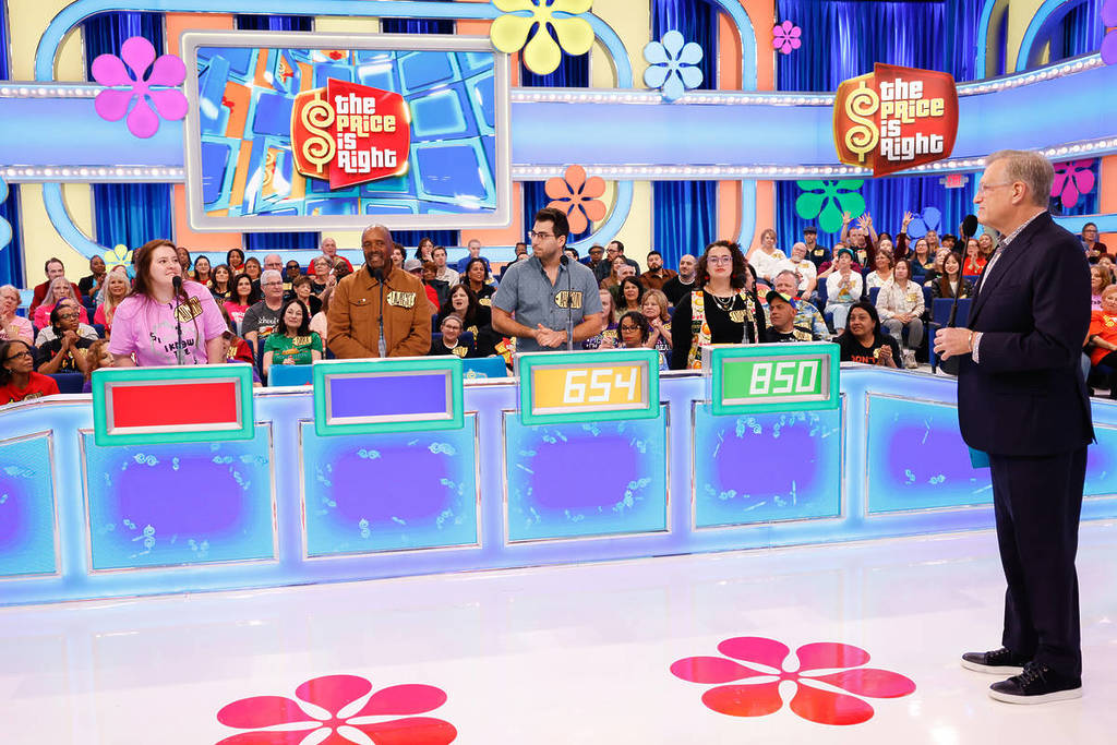 Contestants participating in a pricing game on The Price is Right