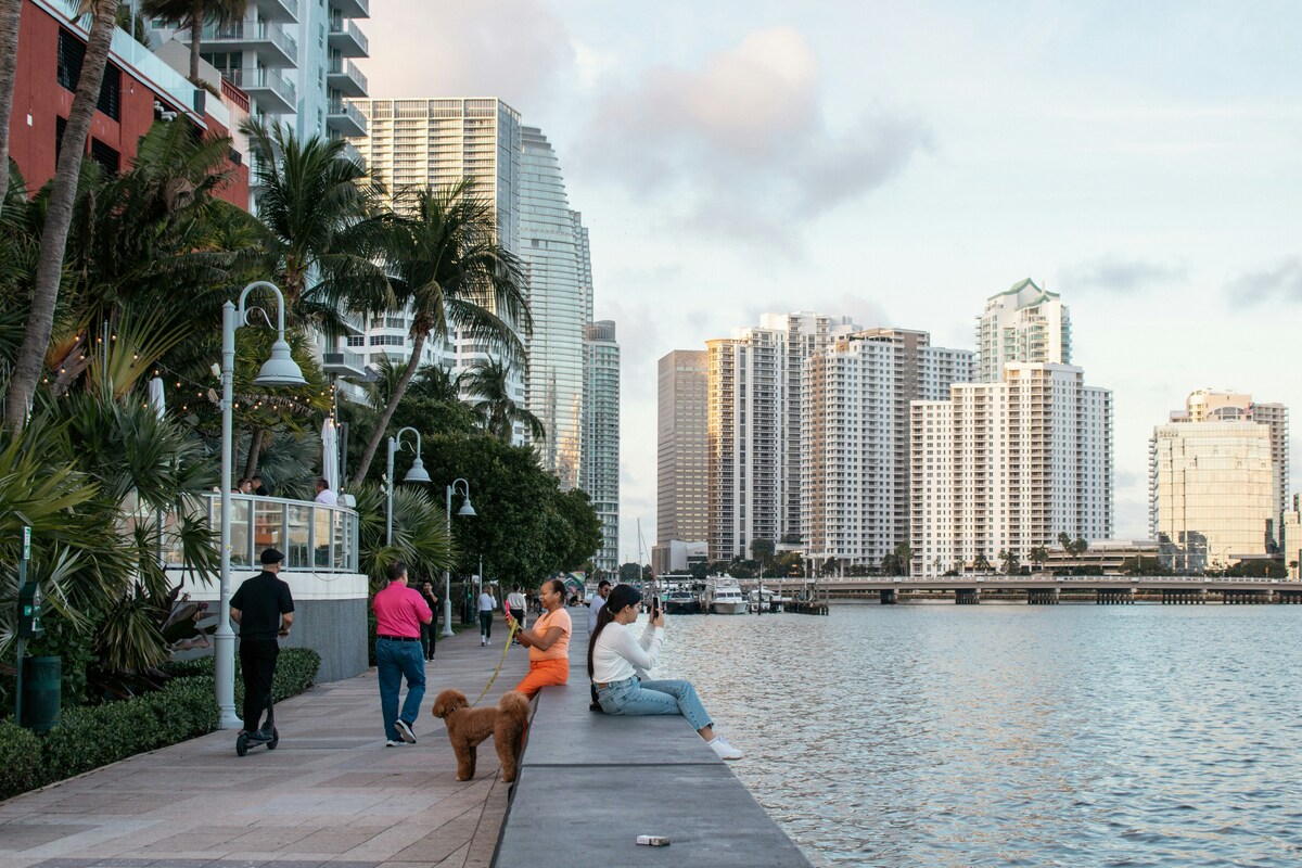 People enjoy a waterfront view of Miami's skyline