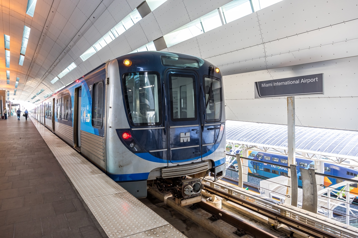 Metro Miami train by Hitachi Rail Miami-Dade Metrorail at Airport station public transport rapid transit in Miami, United States.
