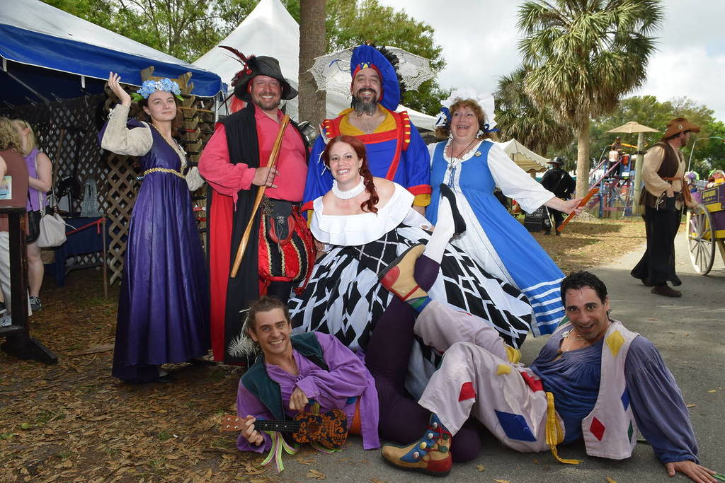 people wear fancy costumes as part of Florida Renaissance Festival