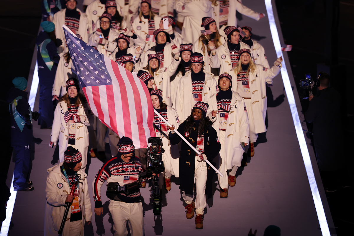 MILAN, ITALY - FEBRUARY 06: Flagbearer Erin Jackson of Team United States leads the team in the parade during the opening ceremony of the Milano Cortina 2026 Winter Olympics at San Siro Stadium on February 06, 2026 in Milan, Italy.