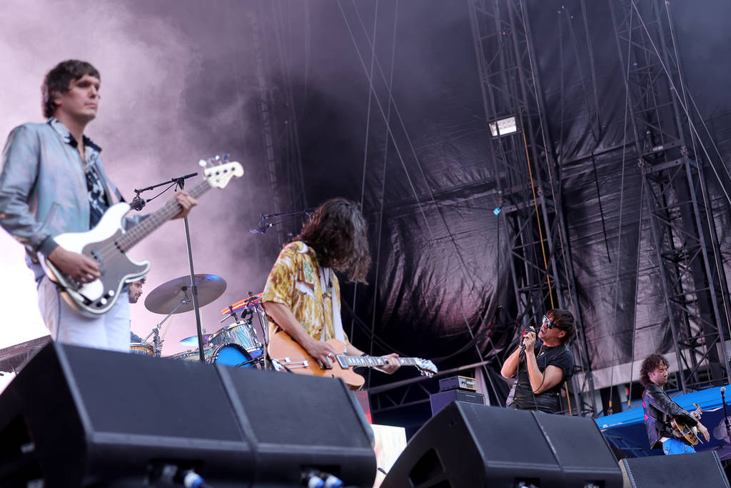 EAST RUTHERFORD, NEW JERSEY - AUGUST 17: (L-R) Nikolai Fraiture, Nick Valensi, Julian Casablancas and Albert Hammond Jr. of the Strokes perform before the Red Hot Chili Peppers at MetLife Stadium on August 17, 2022 in East Rutherford, New Jersey.