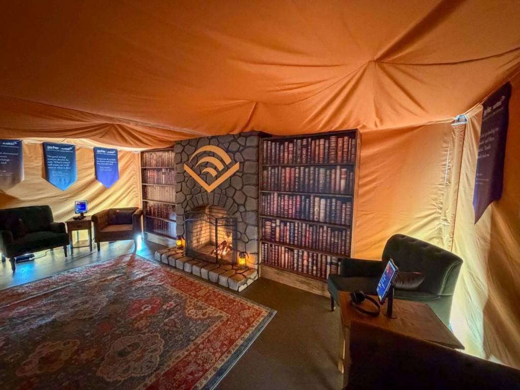 audible listening tent with carpet and mock fireplace