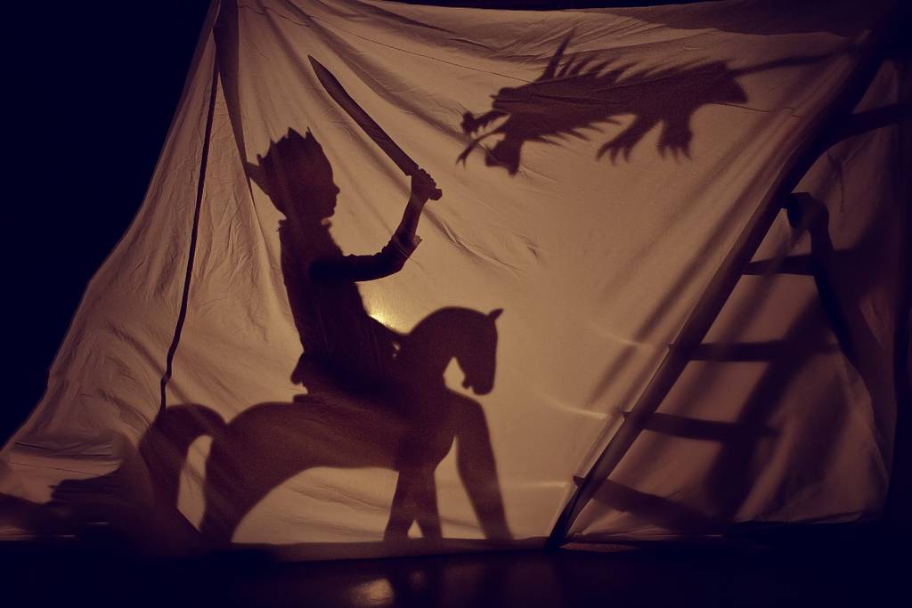 shadow play, knight fights dragon