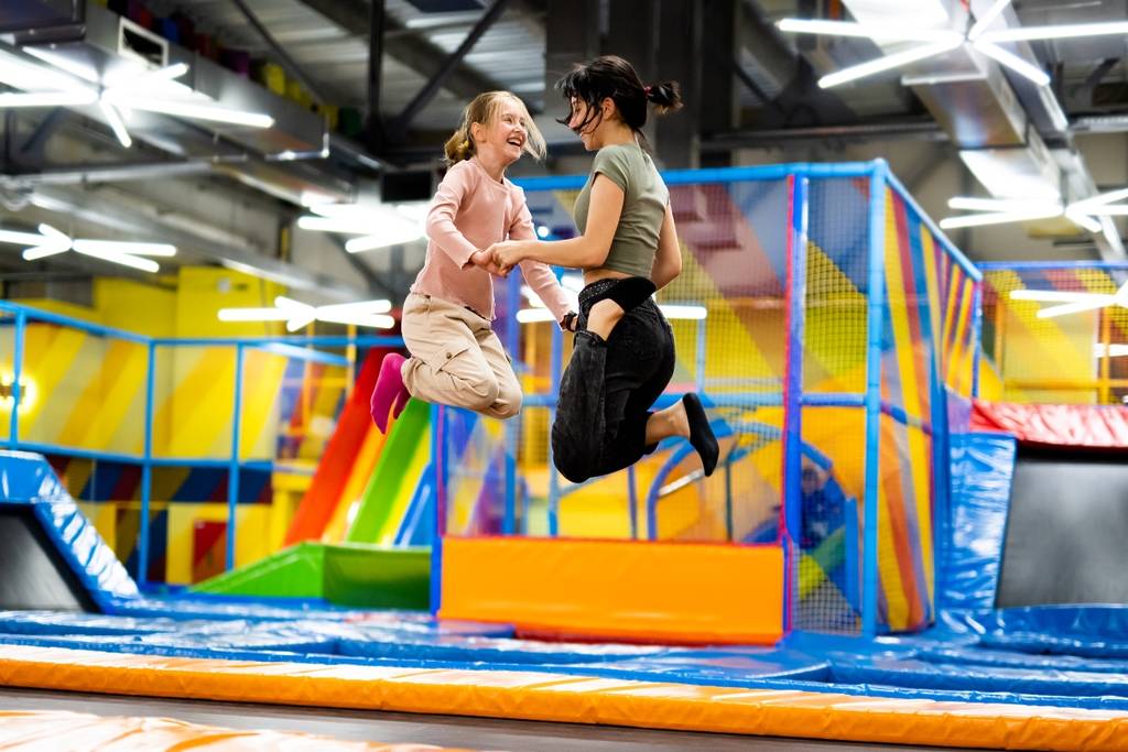 kids jump on a trampoline