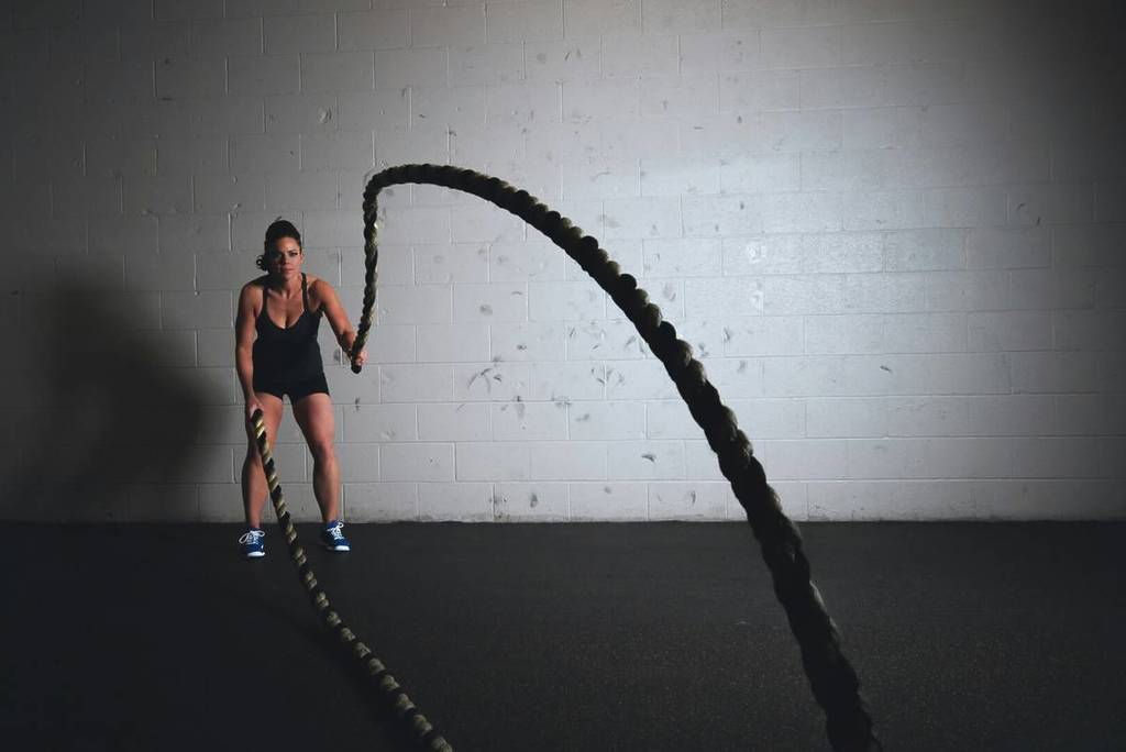 woman with battle ropes