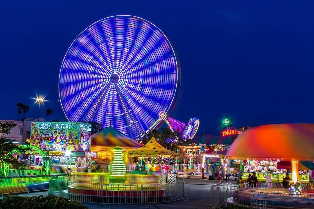 illuminated rides at a folk festival at night