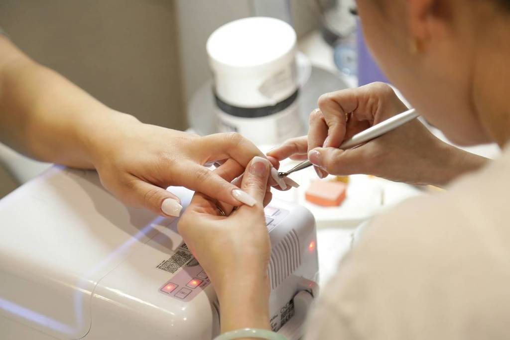 woman getting a nail salon treatment