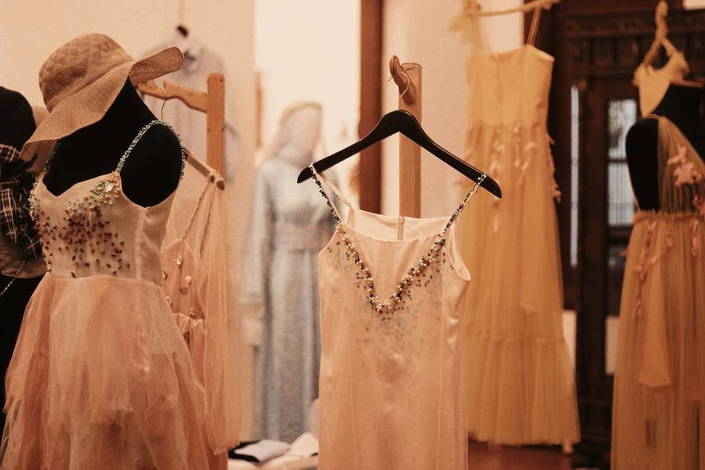 clothes on hangers in a store